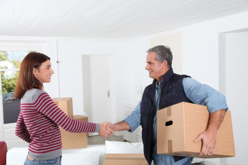 Professional flat removals in Walthamstow Village with packed boxes and moving van