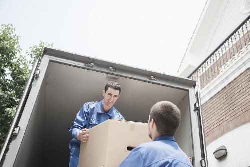 Professional movers handling furniture during house removals